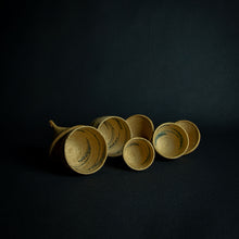 Load image into Gallery viewer, Set of African woven baskets resembling huts, the smallest without a lid.