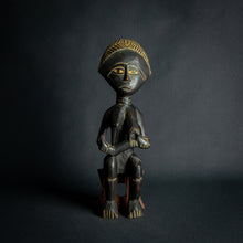 Load image into Gallery viewer, Intricately carved Ashanti Maternity figure, symbolizing fertility and traditional Ashanti motherhood, set against a dark backdrop.