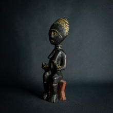 Load image into Gallery viewer, Intricately carved Ashanti Maternity figure, symbolizing fertility and traditional Ashanti motherhood, set against a dark backdrop.
