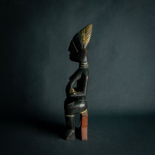 Load image into Gallery viewer, Intricately carved Ashanti Maternity figure, symbolizing fertility and traditional Ashanti motherhood, set against a dark backdrop.