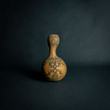 Load image into Gallery viewer, Intricately designed Dogon calabash, featuring traditional geometric patterns and cultural symbols, set against a dark background.