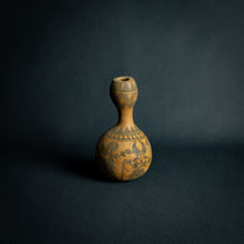 Load image into Gallery viewer, Intricately designed Dogon calabash, featuring traditional geometric patterns and cultural symbols, set against a dark background.