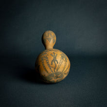 Load image into Gallery viewer, Intricately designed Dogon calabash, featuring traditional geometric patterns and cultural symbols, set against a dark background.