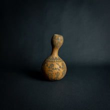 Load image into Gallery viewer, Intricately designed Dogon calabash, featuring traditional geometric patterns and cultural symbols, set against a dark background.