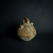 Load image into Gallery viewer, Handcrafted African earthenware vessel with traditional geometric patterns, symbolizing the artistry and heritage of African pottery.