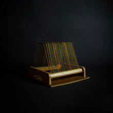 Load image into Gallery viewer, A vintage disc holder made of wood, with a capacity to hold 25 records. The holder has two handles for easy carrying and a simple yet stylish design that fits in with any room decor.