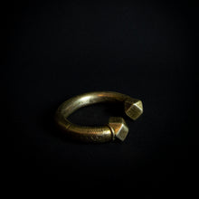 Load image into Gallery viewer, A close-up photo of a vintage brass bracelet with ethnic designs, showcasing the intricate patterns and rustic feel of the brass material.