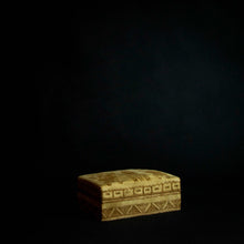 Load image into Gallery viewer, Beautiful box made of animal skin with intricate designs inspired by Senufo masks and animals. The box is adorned with rich patterns and textures, and has a unique and rustic feel. It can be used for storage or as a decorative piece in any home.