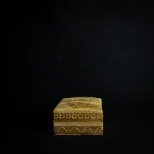 Load image into Gallery viewer, Beautiful box made of animal skin with intricate designs inspired by Senufo masks and animals. The box is adorned with rich patterns and textures, and has a unique and rustic feel. It can be used for storage or as a decorative piece in any home.