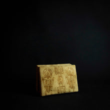 Load image into Gallery viewer, Beautiful box made of animal skin with intricate designs inspired by Senufo masks and animals. The box is adorned with rich patterns and textures, and has a unique and rustic feel. It can be used for storage or as a decorative piece in any home.