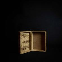 Load image into Gallery viewer, Beautiful box made of animal skin with intricate designs inspired by Senufo masks and animals. The box is adorned with rich patterns and textures, and has a unique and rustic feel. It can be used for storage or as a decorative piece in any home.