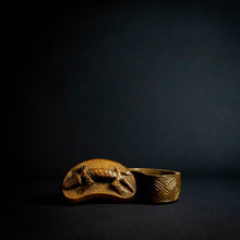 Load image into Gallery viewer, Handcrafted wooden box with half-moon shape and intricately carved crocodile on lid, made by Kuba tribe artisans in the D.R. Congo. Perfect for storage or as a decorative accent in any room.