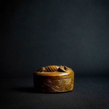 Load image into Gallery viewer, Handcrafted wooden box with half-moon shape and intricately carved crocodile on lid, made by Kuba tribe artisans in the D.R. Congo. Perfect for storage or as a decorative accent in any room.