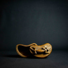 Load image into Gallery viewer, Handcrafted wooden box with half-moon shape and intricately carved crocodile on lid, made by Kuba tribe artisans in the D.R. Congo. Perfect for storage or as a decorative accent in any room.