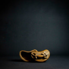 Load image into Gallery viewer, Handcrafted wooden box with half-moon shape and intricately carved crocodile on lid, made by Kuba tribe artisans in the D.R. Congo. Perfect for storage or as a decorative accent in any room.