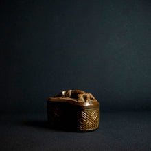 Load image into Gallery viewer, Handcrafted wooden box with half-moon shape and intricately carved crocodile on lid, made by Kuba tribe artisans in the D.R. Congo. Perfect for storage or as a decorative accent in any room.