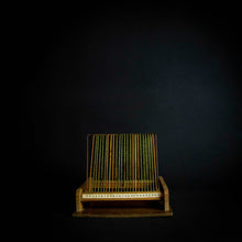 Load image into Gallery viewer, A vintage disc holder made of wood, with a capacity to hold 25 records. The holder has two handles for easy carrying and a simple yet stylish design that fits in with any room decor.