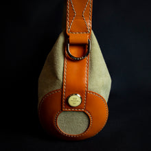 Load image into Gallery viewer, Limited edition "Roland Garros" Lancel handbag with a unique "baguette" shape, perfect for collectors of rare handbags and tennis enthusiasts.
