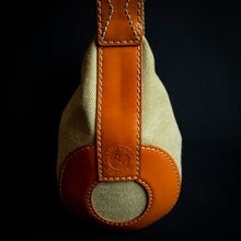 Load image into Gallery viewer, Limited edition "Roland Garros" Lancel handbag with a unique "baguette" shape, perfect for collectors of rare handbags and tennis enthusiasts.