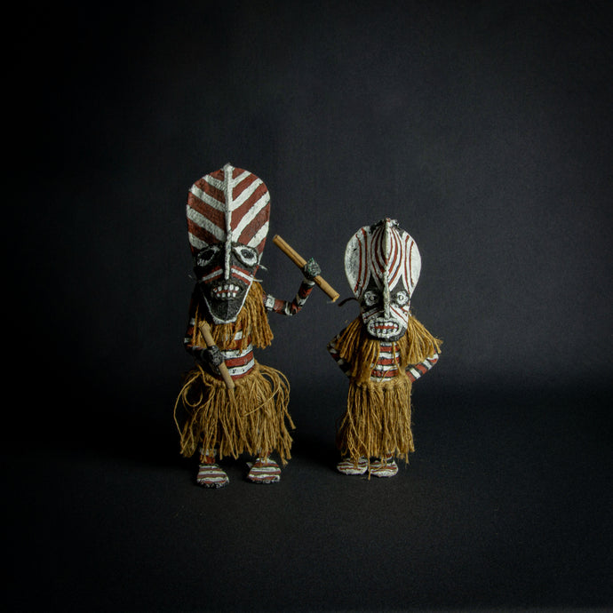 Chokwe Makishi dolls representing ancestral spirits with traditional geometric patterns.