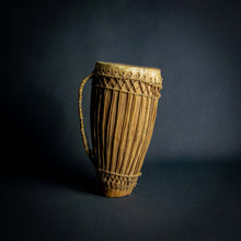 Load image into Gallery viewer, Traditional African hand drum with a tapered wooden body, intricate ropework, and a weathered hide head, evoking the spirit of African music.
