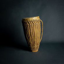 Load image into Gallery viewer, Traditional African hand drum with a tapered wooden body, intricate ropework, and a weathered hide head, evoking the spirit of African music.
