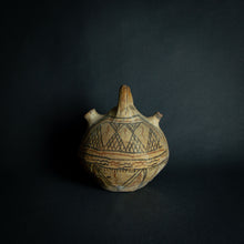 Load image into Gallery viewer, Handcrafted African earthenware vessel with traditional geometric patterns, symbolizing the artistry and heritage of African pottery.
