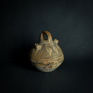 Handcrafted African earthenware vessel with traditional geometric patterns, symbolizing the artistry and heritage of African pottery.