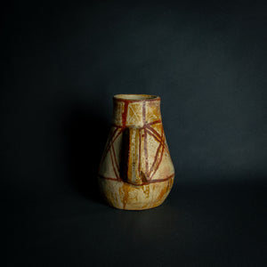 African clay pot with traditional painted geometric patterns, a testament to timeless craftsmanship.