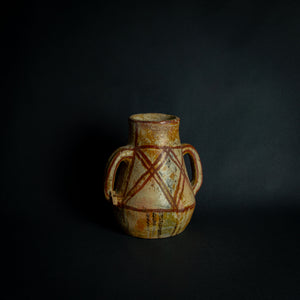 African clay pot with traditional painted geometric patterns, a testament to timeless craftsmanship.