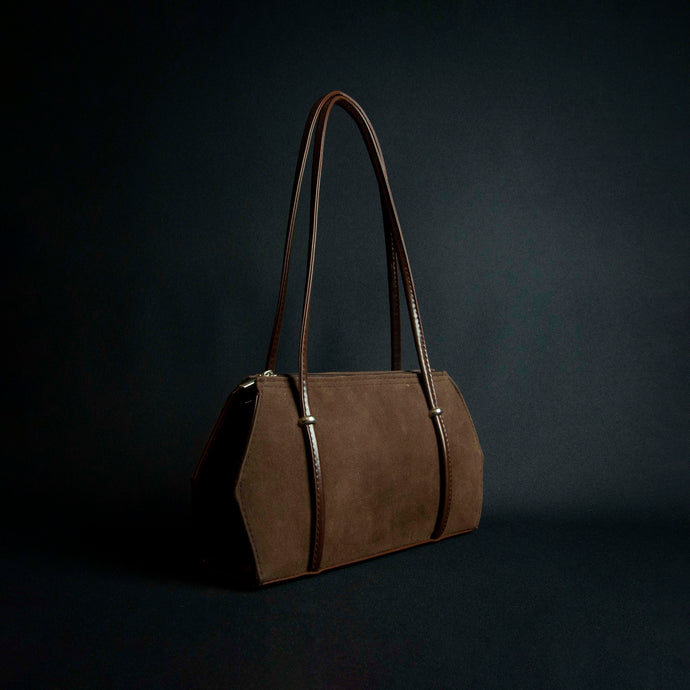 Brown handbag with large handles and silver-colored details