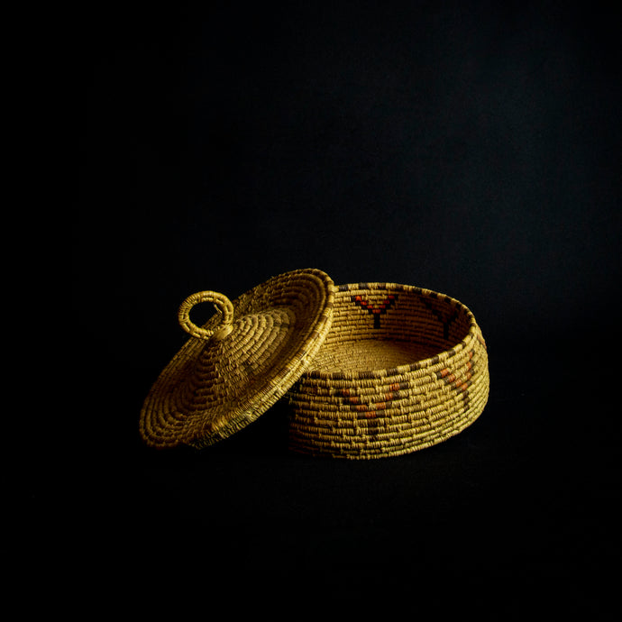 Handmade Raffia basket from Africa featuring stunning geometrical designs, made from natural fibers and eco-friendly materials.