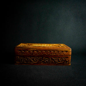 Handcrafted Indian rosewood box with intricate flower carvings on the lid, perfect for storage or decoration.