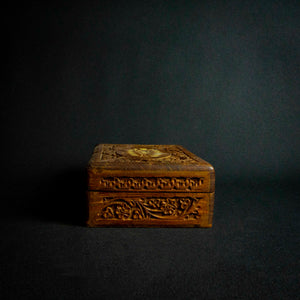 Handcrafted Indian rosewood box with intricate flower carvings on the lid, perfect for storage or decoration.