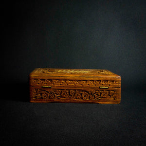 Handcrafted Indian rosewood box with intricate flower carvings on the lid, perfect for storage or decoration.