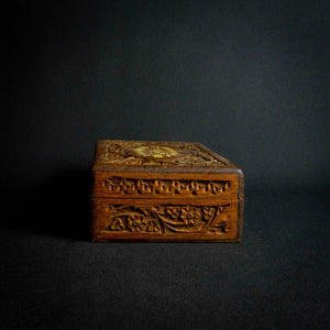 Handcrafted Indian rosewood box with intricate flower carvings on the lid, perfect for storage or decoration.