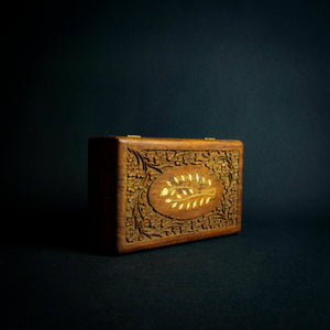 Handcrafted Indian rosewood box with intricate flower carvings on the lid, perfect for storage or decoration.