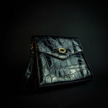 Load image into Gallery viewer, Vintage black crocodile-look handbag with gold buckle
