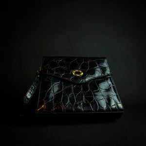 Vintage black crocodile-look handbag with gold buckle