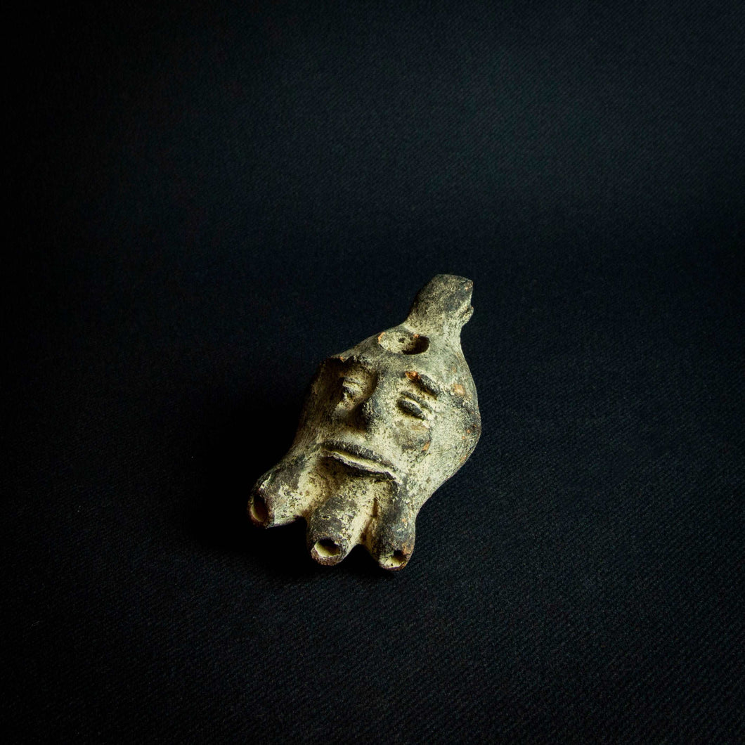 Terracotta Oil Lamp in Roman Style with Decorative Medallion featuring man's face and three spouts.