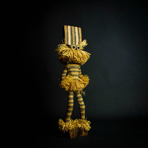 Ethnographic doll representing the Pende Munganji spirit dancers of Zaire, made of handcrafted wood and raffia material.