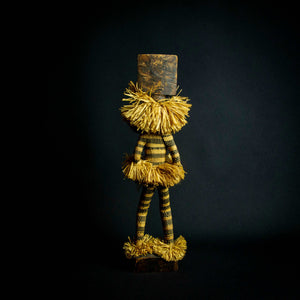 Ethnographic doll representing the Pende Munganji spirit dancers of Zaire, made of handcrafted wood and raffia material.